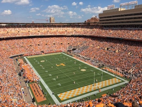 Image of Neyland Stadium with full crowd in orange. Courtesy of Steve DiMatteo on Unsplash.